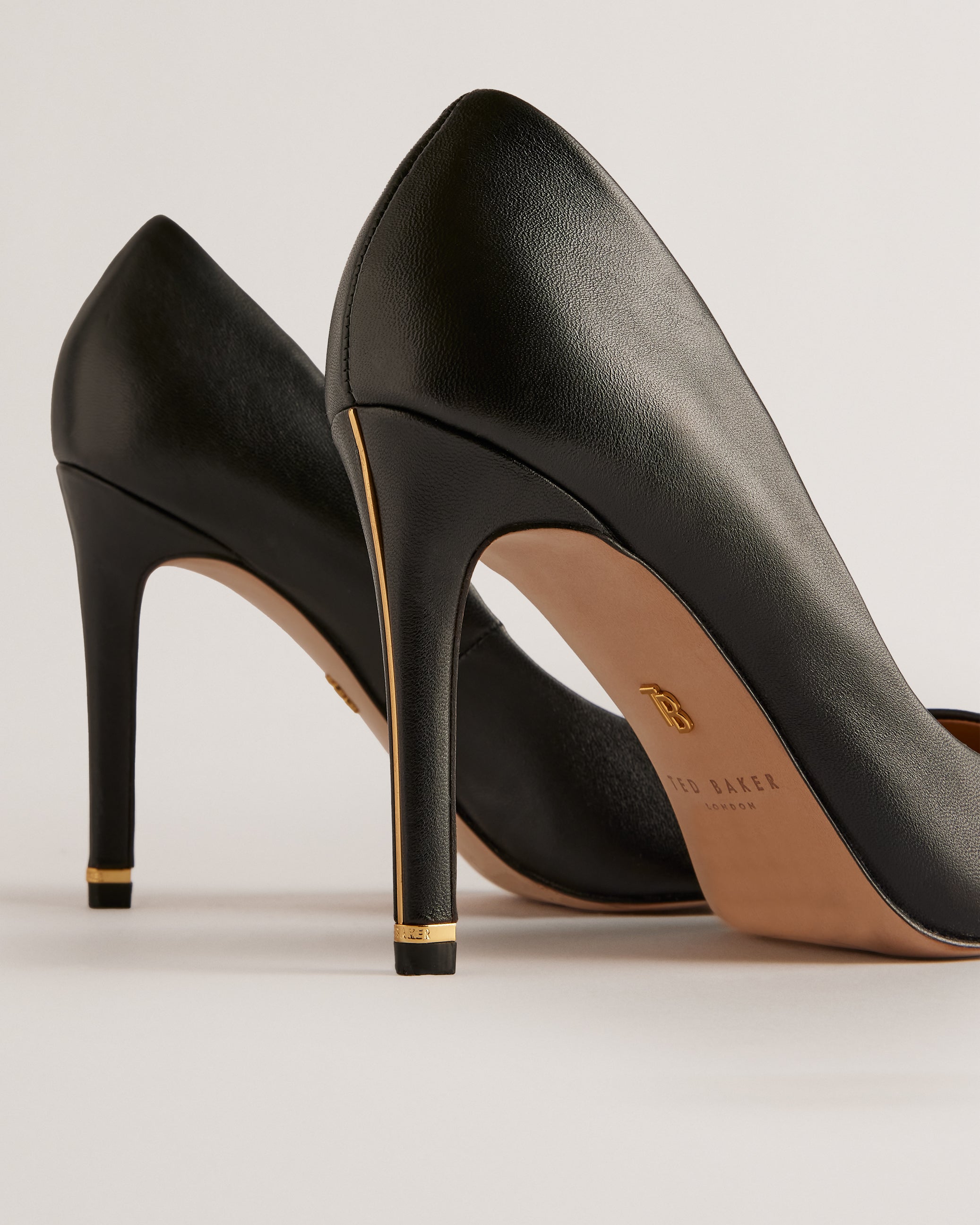 Caaraa High-Heeled Pump With River Of Gold Heel Black