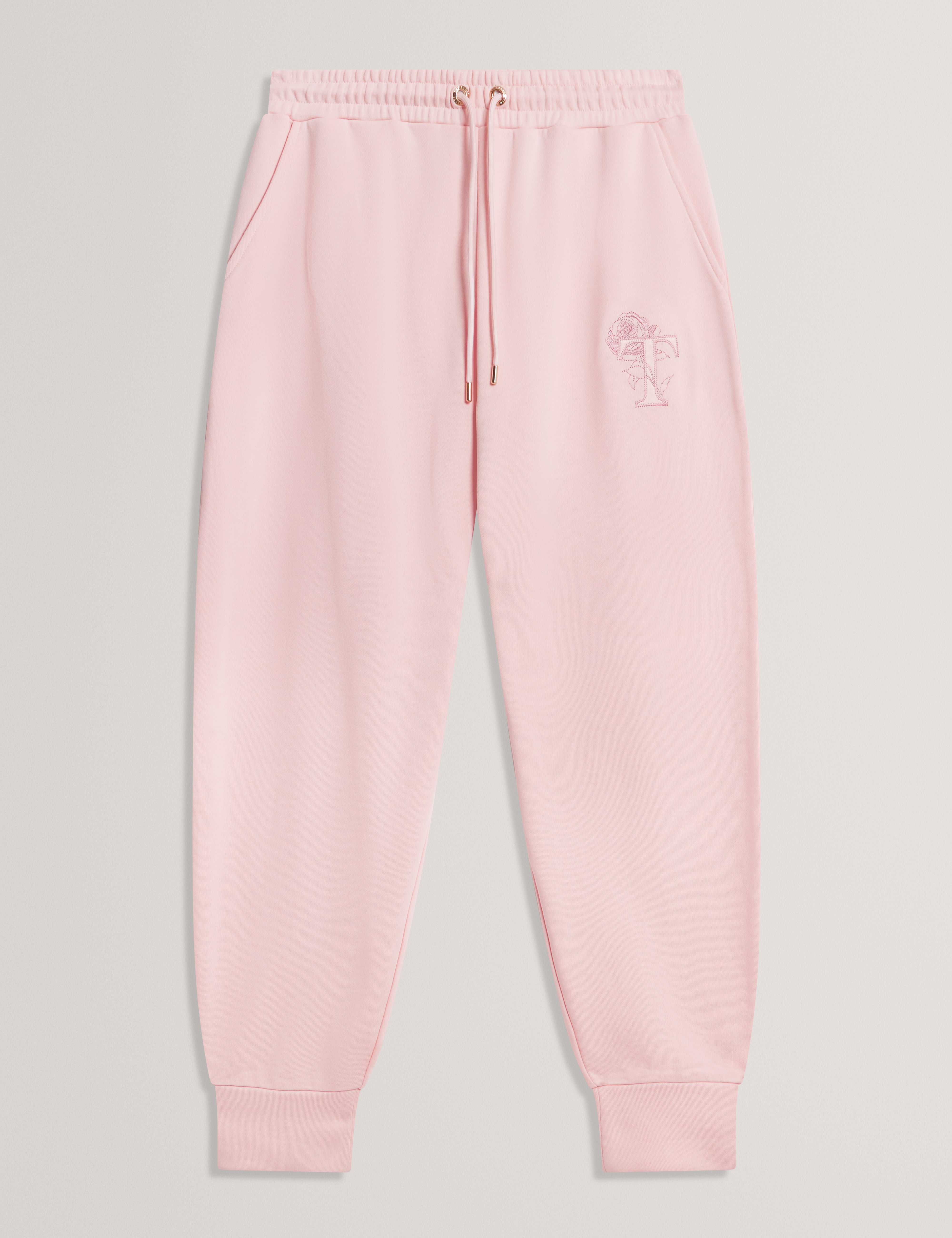 بنطال رياضي وردي اللون من ماركة كاليتري تي، بقصة أرجل أسطوانية.